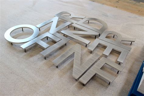 brushed aluminum fabricated buidling letters|custom aluminum letters.